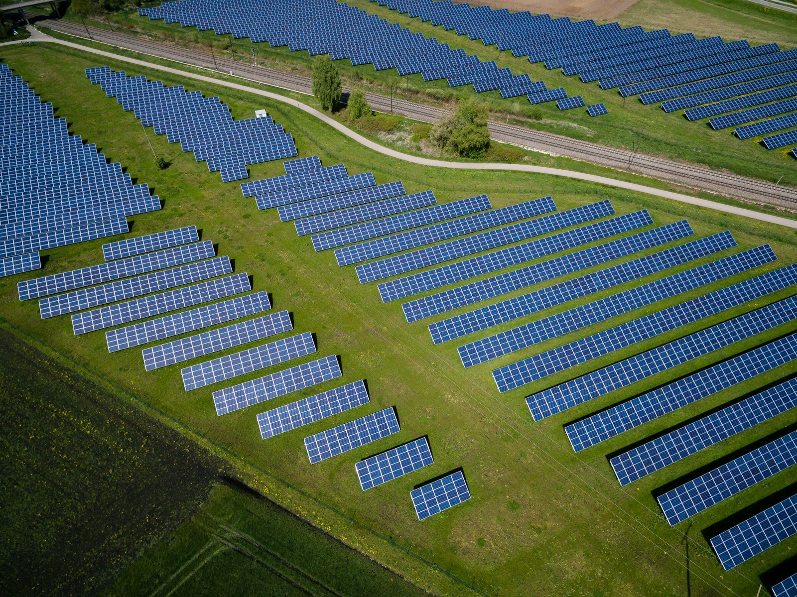 http://aerial%20photography%20of%20grass%20field%20with%20blue%20solar%20panels